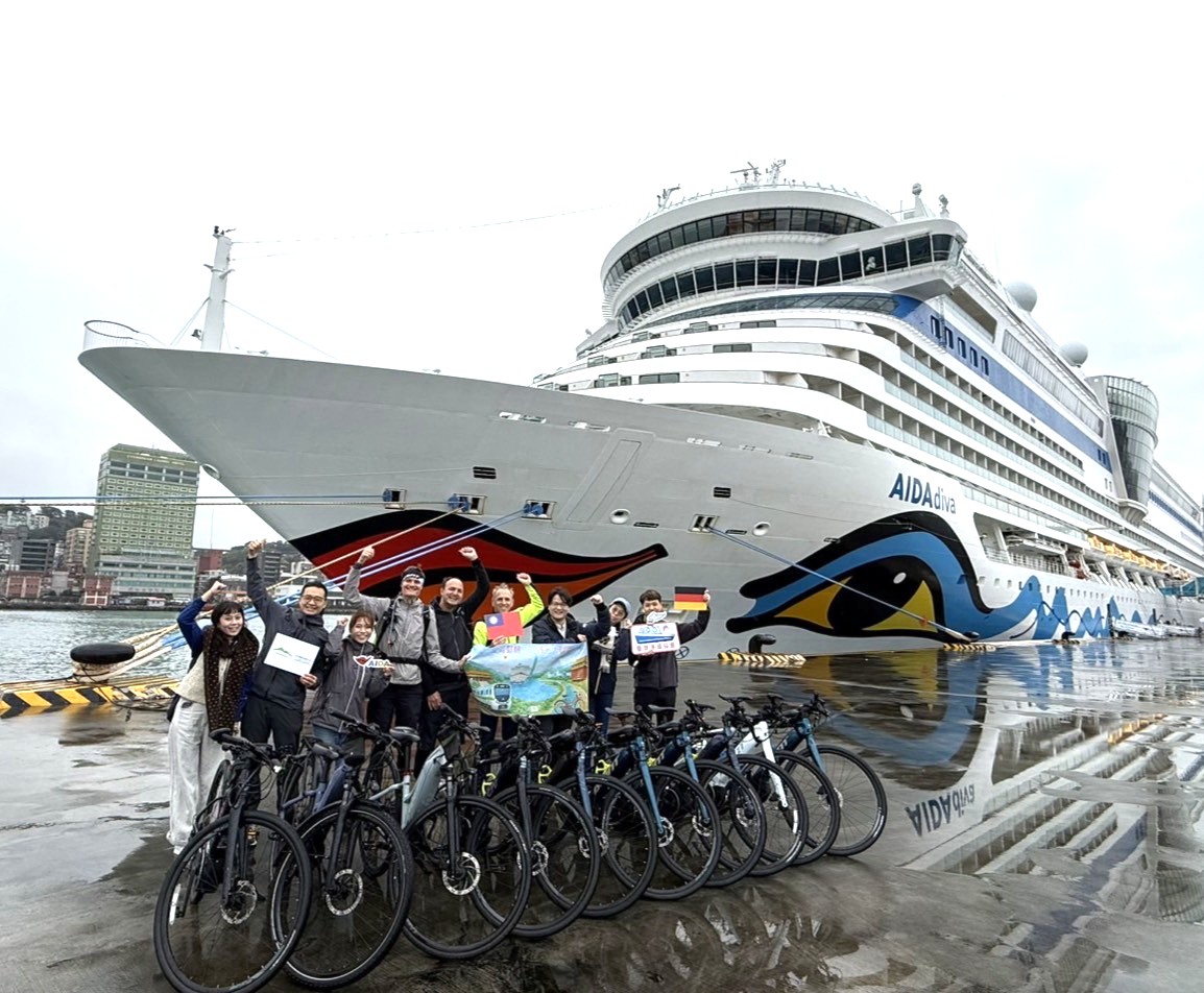 Image 3. Cruise & Cycle Tourism Alliance cycle team stop in front of the AIDAdiva for a group photo before setting out